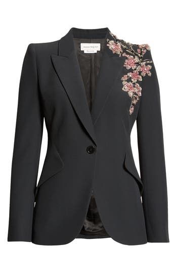 The sharp tailoring seen throughout the fashion house's 2024 runway collection shines through the powerful shoulders of a blazer blooming with crystal-embellished floral appliqués. 27" length (size 40 IT) One-button closure Peaked lapels Four-button cuffs Front flap pockets Lined Made in Italy Designer Clothing Tailored Embellished Blazer For Work, Embellished Blazer With Notch Lapel For Work, Embellished Notch Lapel Blazer For Work, Tailored Floral Embroidered Blazer For Formal Occasions, Fitted Embellished Blazer For Workwear, Elegant Formal Suits With Floral Embroidery, Tailored Embellished Blazer For Office, Luxury Evening Suits For Spring, Luxury Spring Evening Suits