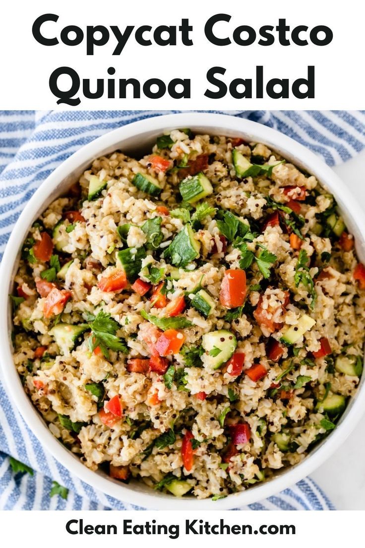 a white bowl filled with rice and vegetables on top of a blue and white towel