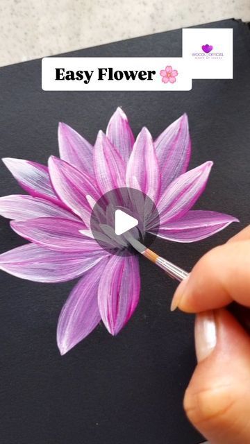 someone is painting a flower with acrylic paint