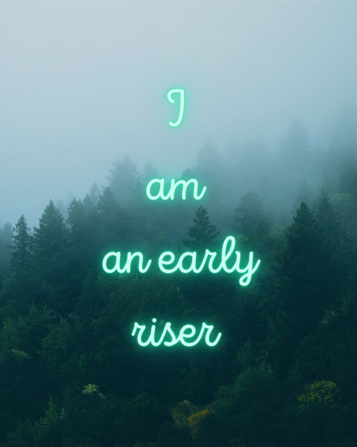 a green neon sign that says i am an early riser in front of some trees