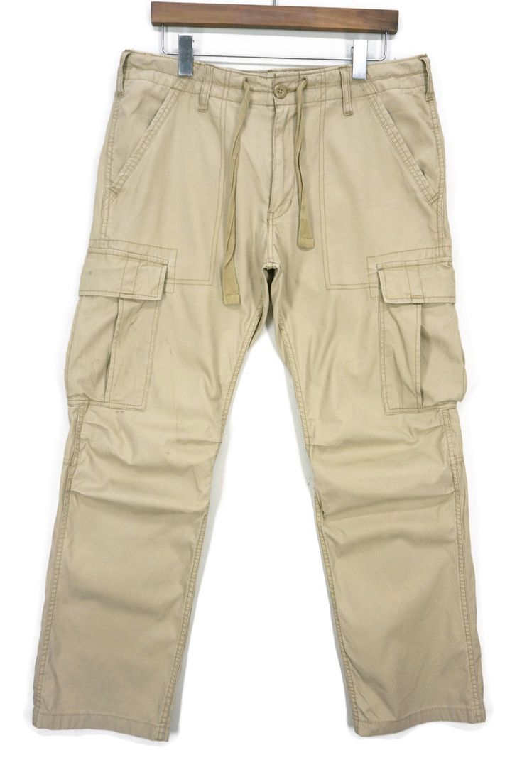 Avirex used cargo pants for sale. - 8/10 good condition. - 100% cotton. - Size L on the tag. - Will fit up to 36 inches waist. - The actual color may a bit different from the pictures. - A few defects. - Signs of wear on the fabrics. - Good in shape. - Please refer to the pictures and measurements. - Measurements (approximately): Waist - up to 36 inches. Laying flat: Inseam - 30.5 inches Total Length - 40 inches Front Rise - 11 inches Top Thigh - 13.5 inches Knee - 9.5 inches Leg Opening - 9 inc Combat Cotton Cargo Pants, Combat Style Cotton Cargo Pants With Multiple Pockets, Combat Style Cotton Cargo Jeans With Patch Pockets, Cotton Combat Cargo Pants With Hip Pockets, Tactical Cotton Cargo Style Pants, Tactical Cotton Cargo Pants, Tactical Cotton Cargo Pants With Pockets, Tactical Cotton Cargo Pants With Multiple Pockets, Tactical Cotton Cargo Jeans With Pockets