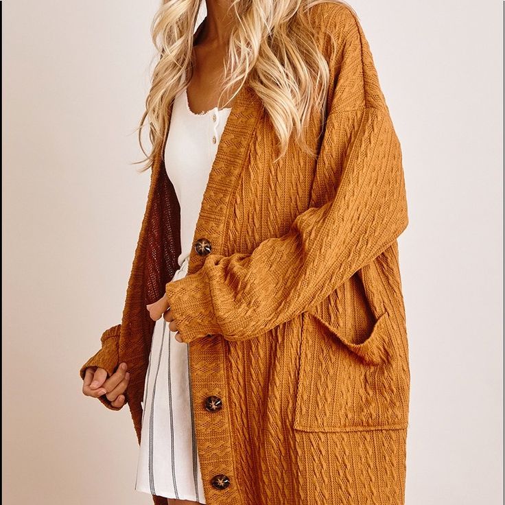 Oversized Cardigan With Pockets Brown V-neck Sweater Coat For Spring, Chic Brown Cardigan For Winter, Brown Cable Knit V-neck Outerwear, Chic Brown Winter Cardigan, Brown Long Sleeve Cable Knit Sweater Coat, Chic Brown Cardigan With Pockets, Chic Brown Long Sleeve Sweater Coat, Cozy Brown Long Sleeve Cardigan, Brown Long Sleeve Cable Knit Outerwear