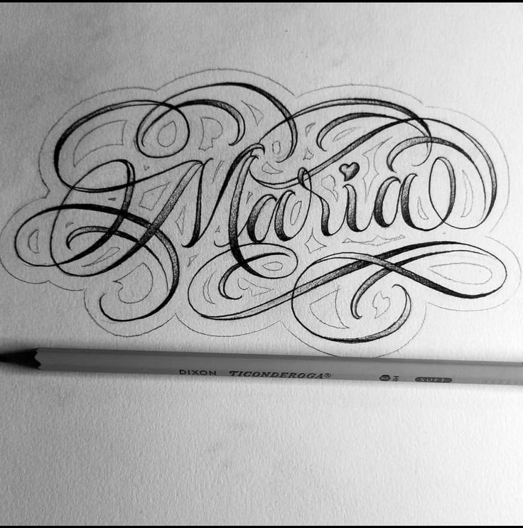 the word mario written in cursive writing on a piece of paper with a pencil