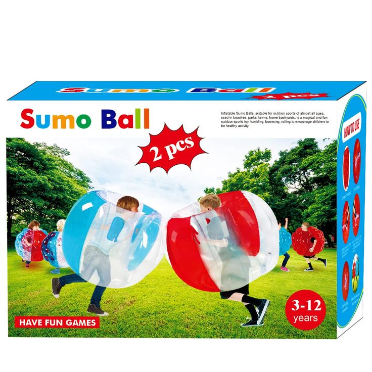 two kids are playing with sumo ball in the grass, and one boy is wearing an inflatable costume