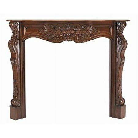 an ornate wooden fireplace mantel with carvings on the top and bottom, in dark wood