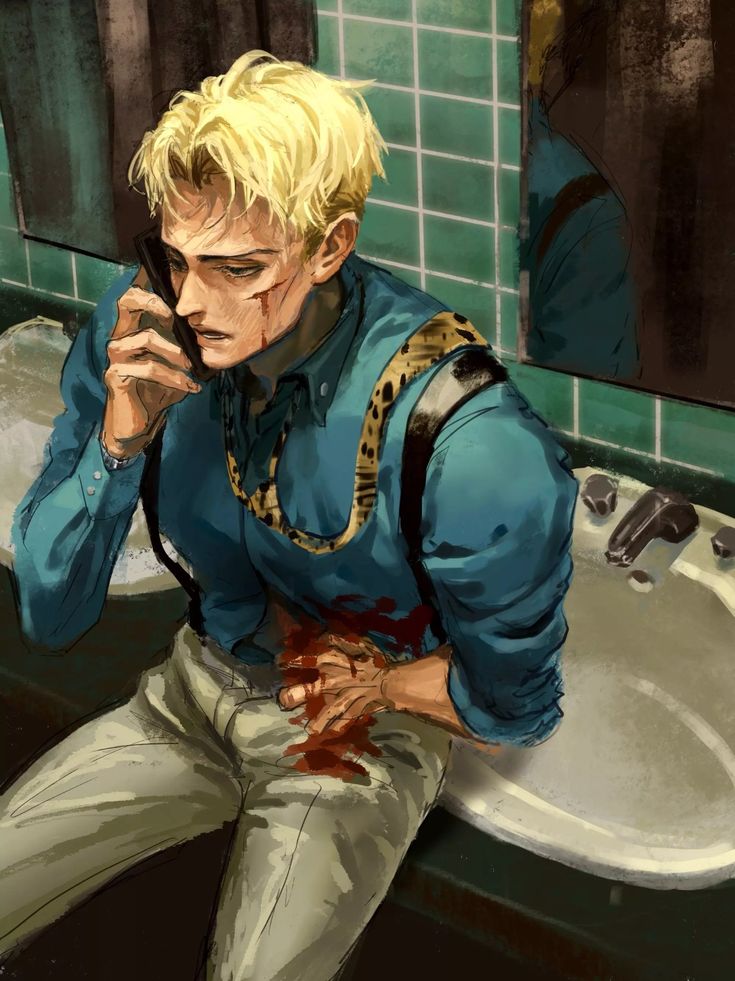 a man sitting in front of a sink talking on a cell phone while holding a knife