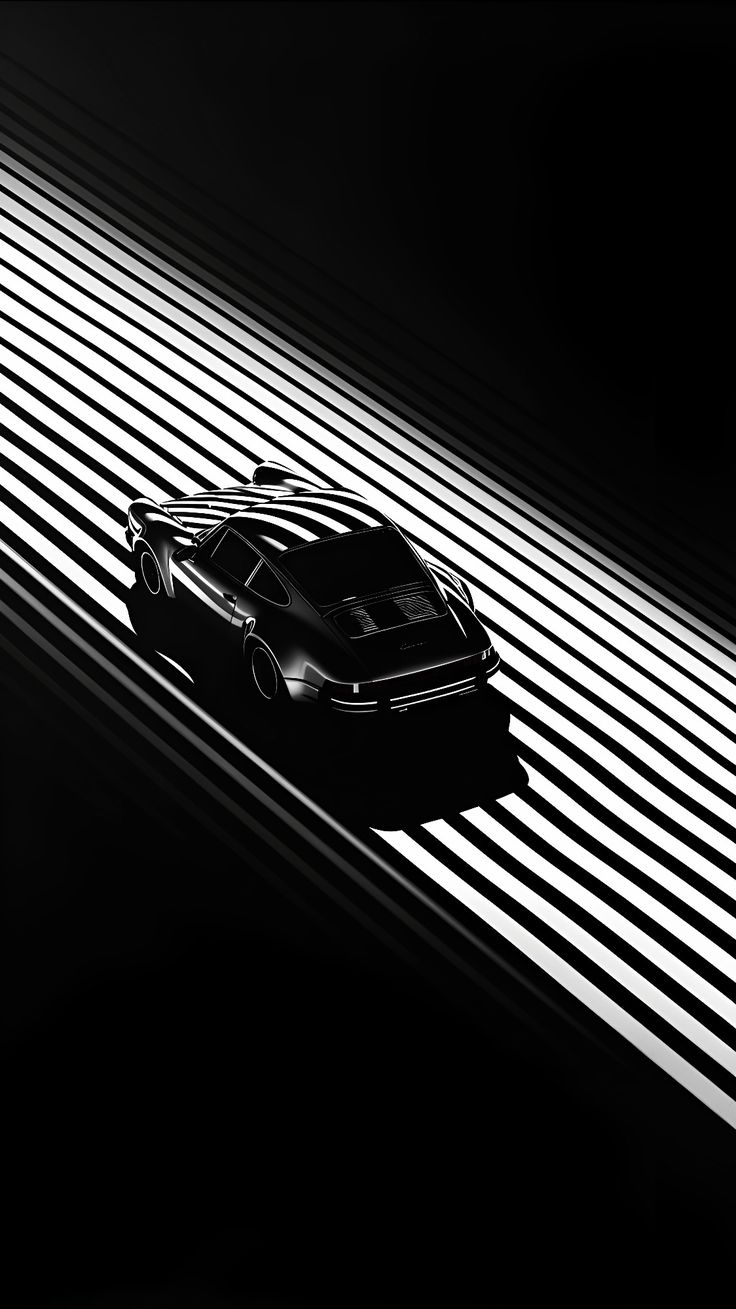 a black and white photo of a car driving on a road with vertical lines in the background