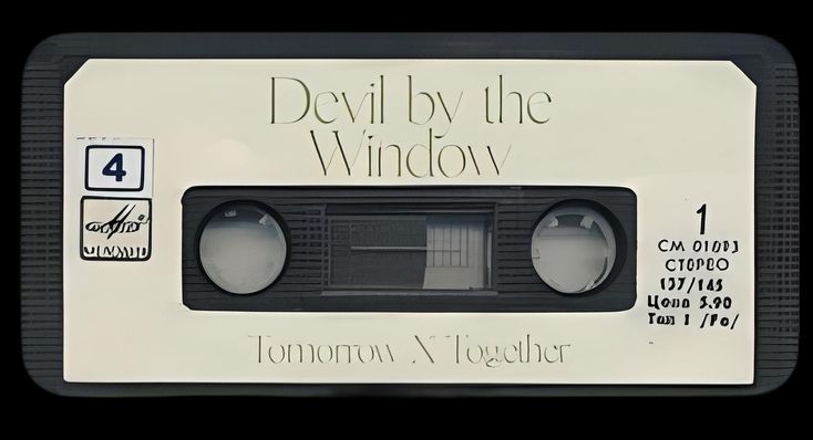 an old black and white tape recorder with the words devil by the window on it