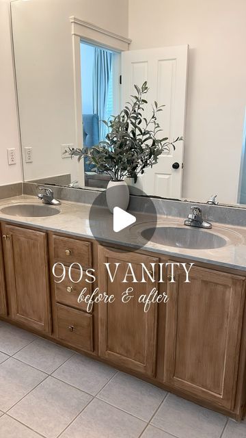 a large bathroom with two sinks and a plant in the middle of the counter top