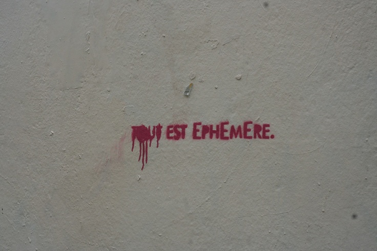 graffiti on the side of a building that says, my est ememere '