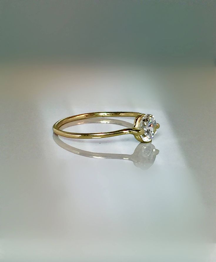 Simple and unique Floating Stone Ring. This ring is Extremely cute and Dainty also for stacking, thumb or midi and a great addition for your collection or as a perfect gift. --Great for Baby/kids as birthstone Rings. --14k/10k Real Solid Gold --Band Thickness: 1.0mm --CZ approx : 3mm wide = 0.10 ctw --Diamond Option: Natural .10 ct Si quality ** Limited time SALE ** Order Yours Today Please message me for larger size! SALE!! Great Value! **Dainty Rings On SALE Now** **100% Quality Guaranteed** - Ring Kids, Minimalist Diamond Rings, Dainty Gold Ring, Friendship Ring, Dainty Rings, Birthstone Rings, Baby Rings, Dainty Gold Rings, Friendship Rings