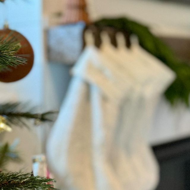 a christmas tree with clothes hanging from it