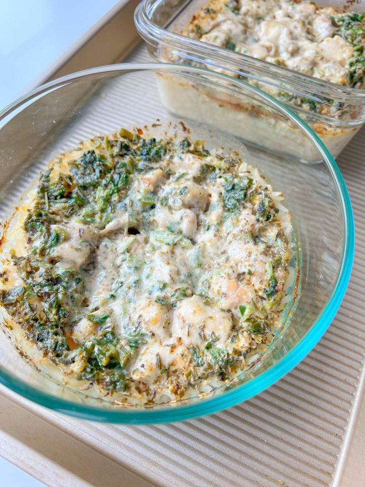 two glass dishes filled with food sitting on top of a counter