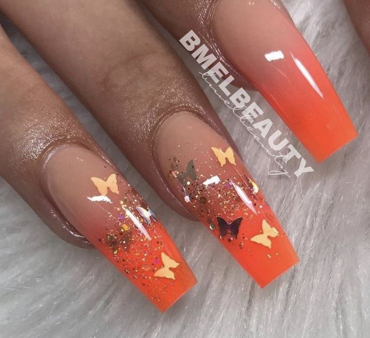 Neon Nails Acrylic Design, Orange Nails With Butterflies, Neon Nails Glitter, Orange Butterfly Nail Designs, Orange Ombre Nails With Design, Neon Butterfly Nails, Butterfly Summer Nails, Dream Nails Acrylic, Orange Coffin Nail Ideas