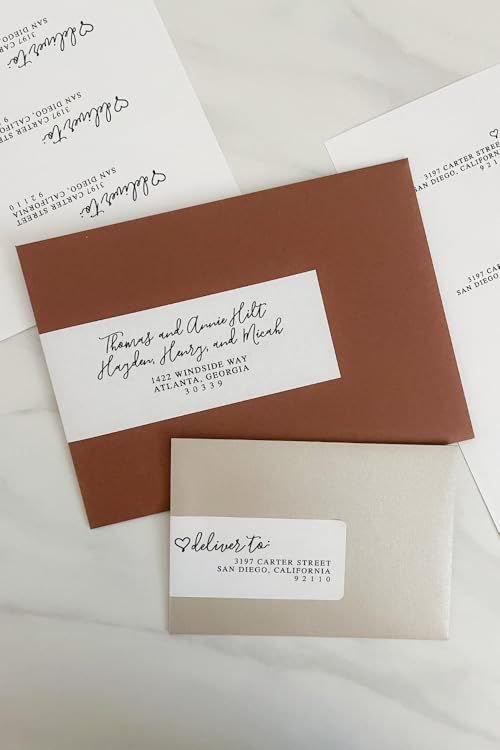 some brown and white envelopes on a table