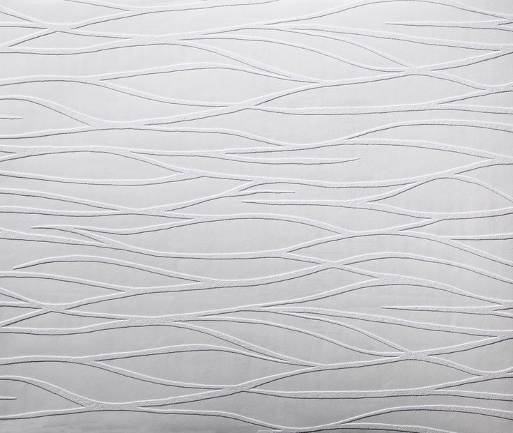 a white pillow with wavy lines on it