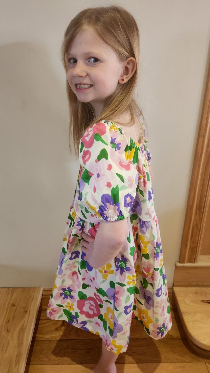 How fun is the puff sleeve?! This cloth material dress had small colorful flowers on it with a detail of buttons on the front! Fit: True to size Small: 7/8 Medium: 9/10 Large: 11/12 Extra large: 13/14 Laundry: wash on cold, low tumble, hang to dry The model is wearing a small. Material Dress, Cloth Material, 9 And 10, Colorful Flowers, Puff Sleeve, Extra Large, 10 Things, Flowers, How To Wear