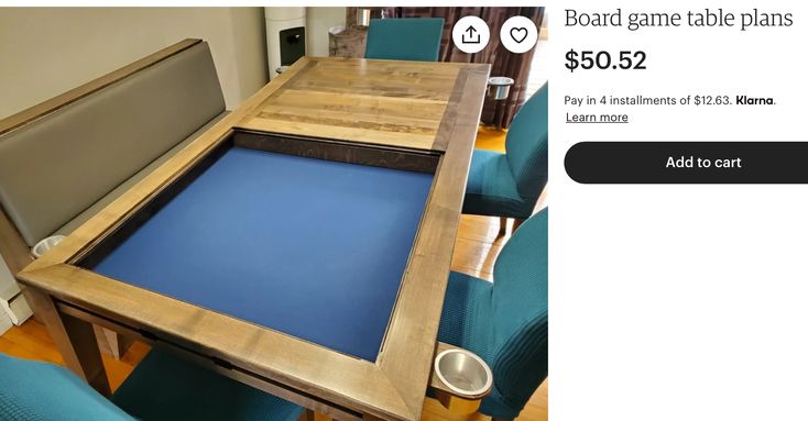 the table is made from wood and has blue fabric on it