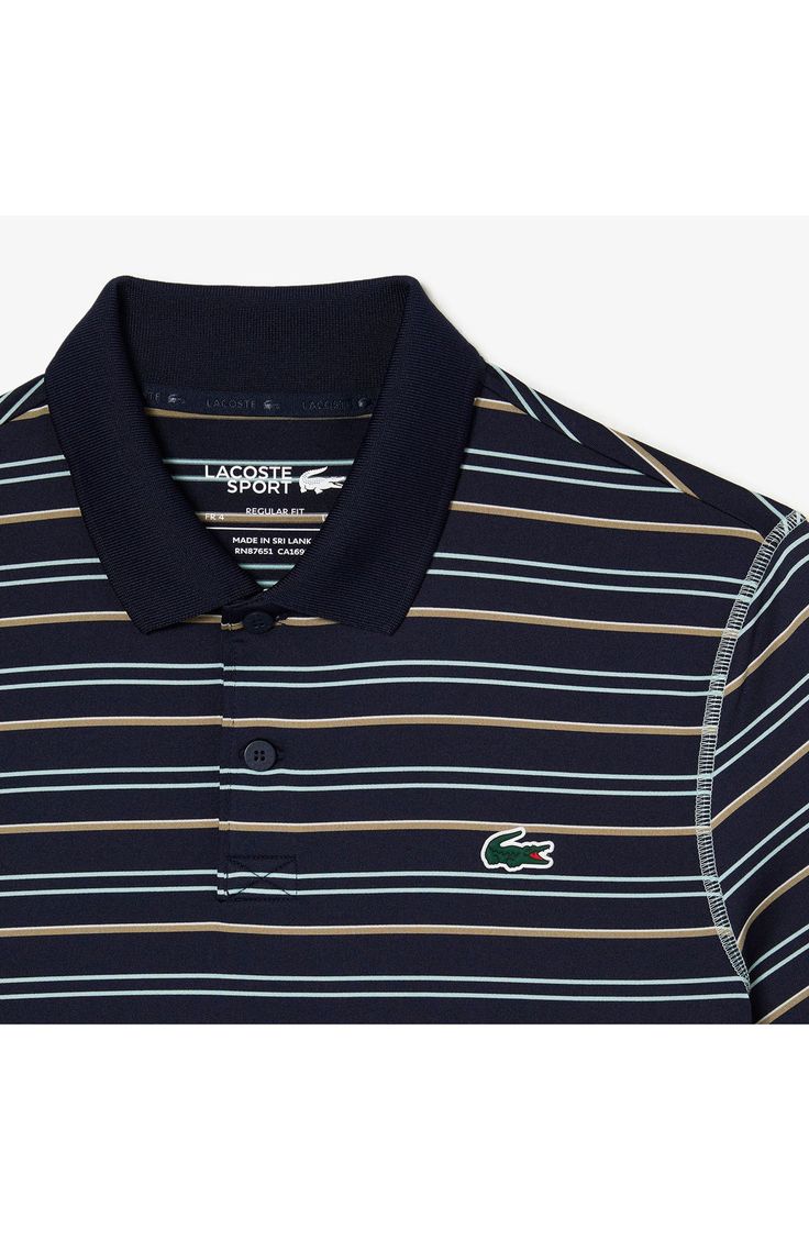 a striped polo shirt with the lacc logo on it and an alligator embroidered on the chest