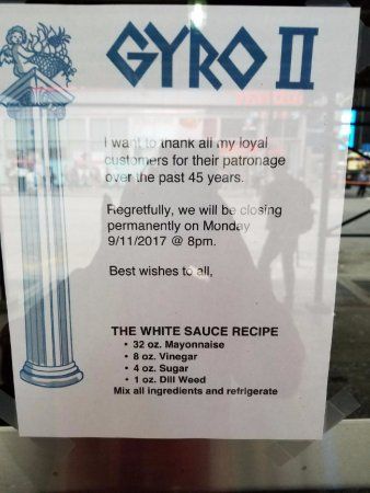 a sign that is posted on the side of a glass door saying, gyro i