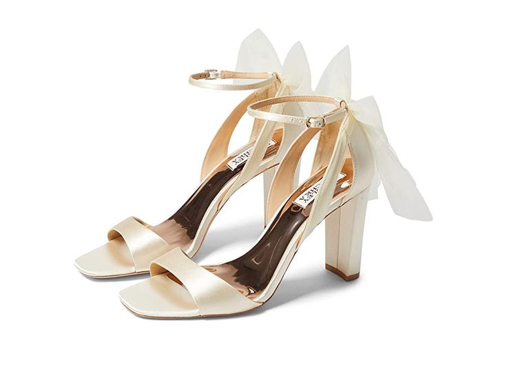 Badgley Mischka Kim - Women's Shoes : Ivory : Get the chic look wearing Badgley Mischka Kim shoes. Upper textile. Synthetic lining. Synthetic insole. Embellished evening shoe. Strappy sandal. Buckle closure. Leather sole. Imported. Measurements: Heel Height: 3 1 2 in Weight: 9 oz Product measurements were taken using size 9, width M. Please note that measurements may vary by size. Weight of footwear is based on a single item, not a pair. Fabric Open Toe Sandals With Heel Strap, Elegant Fabric Heels With Heel Strap, Fabric Ankle Strap Heels For Evening, Elegant Open Toe Fabric Heels, Elegant Fabric Heels For Formal Occasions, Elegant Ankle Strap Sandals With Fabric, Elegant Ankle Strap Fabric Sandals, Elegant Fabric Ankle Strap Sandals, Elegant Evening Sandals In Fabric