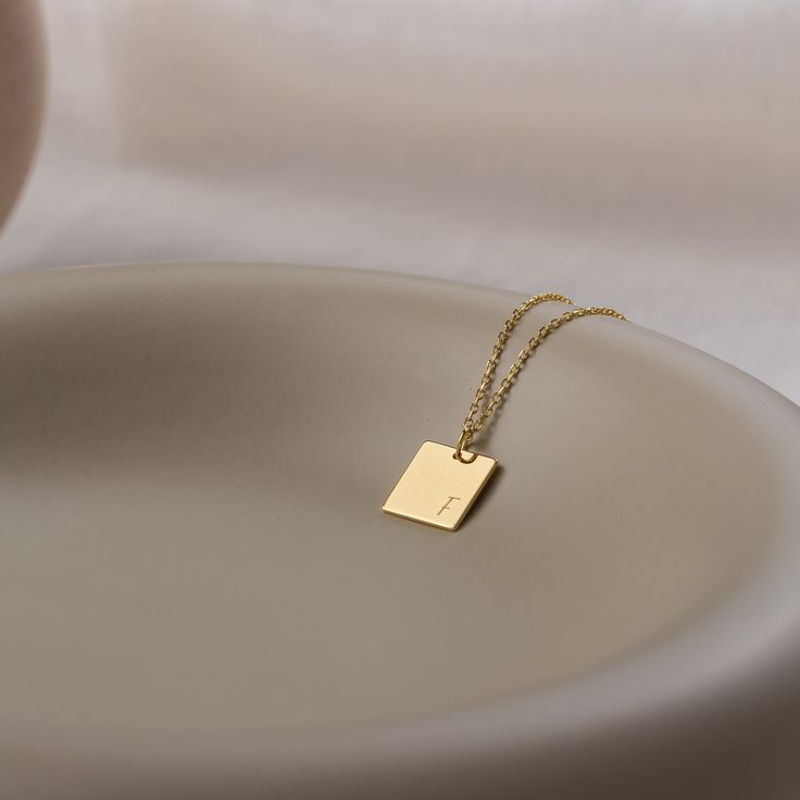 Stylish and minimalist 14K gold personalized rectangle necklace for everyday wear. Great for layering.  Unique personalized gift idea to show love to the important people in your life with a cute, dainty, and creative gift. Customized rectangle tag necklace makes a perfect birthday gift for mothers, friends or yourself.  A special anniversary gift for significant others. Just engrave his/her name. It is a perfect gift. It can be dressed up or dressed down depending on the situation. We only use Classic Rectangular Jewelry For Personalized Gifts, Rectangular Initials Jewelry For Personalized Gift, Personalized Rectangular Initials Jewelry, Gold Rectangular Initial Necklace For Personalized Gift, Elegant Rectangular Initial Necklace For Personalized Gift, Rectangular Initials Jewelry For Gift, Rectangular Initials Necklace For Personalized Gift, Gold Rectangular Minimalist Name Necklace, Elegant Gold Rectangular Initial Necklace