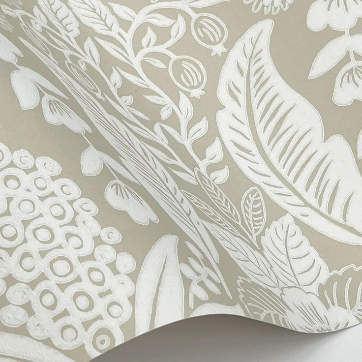 a close up view of a wallpaper with white flowers and leaves on grey background