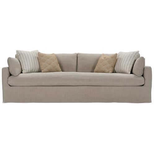 an image of a couch with pillows on it's back and the seat upholstered