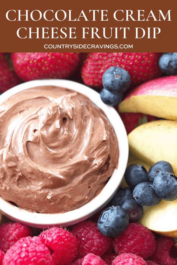 chocolate cream cheese fruit dip in a bowl surrounded by berries and bananas