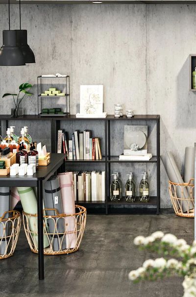 a room filled with lots of different types of furniture and decor on top of wooden shelves