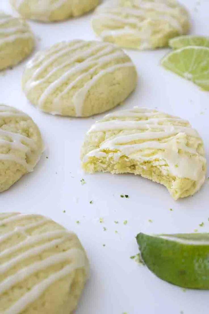 cookies with icing and limes on a baking sheet