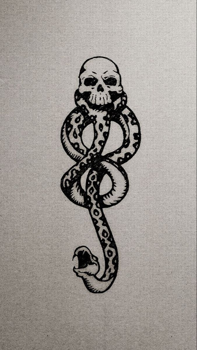 a sticker with a skull and a snake on it's side, in black ink