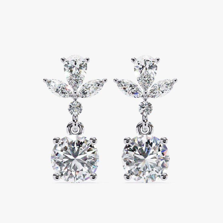 Introducing our exquisite 1.15 CT Dangle Stud Lab Grown Diamond Earrings, a perfect blend of sophistication and modern style. These earrings feature a stunning arrangement of marquise and round-cut diamonds, meticulously set to dangle gracefully. Crafted in luxurious 14k gold with a secure pushback closure, these dangle drop earrings offer both elegance and comfort. Ideal as a dazzling birthday gift or a special treat for her, these earrings are designed to captivate and charm, making every mome Classic Brilliant Cut Chandelier Earrings For Anniversary, Fine Jewelry Bridal Drop Earrings, Classic White Gold Chandelier Earrings With Diamond Cut, Classic Marquise Cluster Earrings For Anniversary, Exquisite Prong Set Drop Earrings, Elegant Gemstone Cluster Drop Earrings, Exquisite Drop Earrings With Prong Setting, Elegant Marquise Diamond Cut Cluster Earrings, Elegant Gemstone Round-cut Earrings