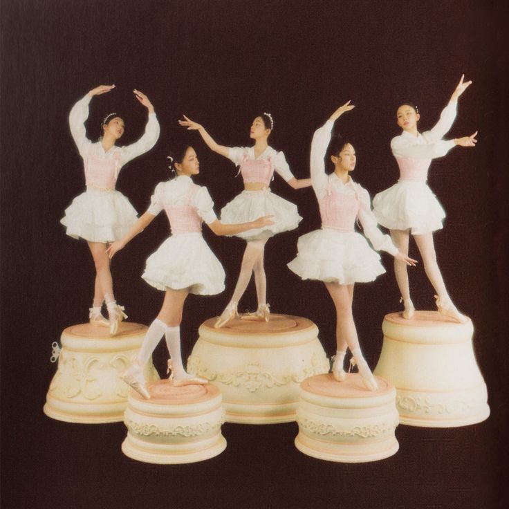 a group of ballerinas standing on top of each other