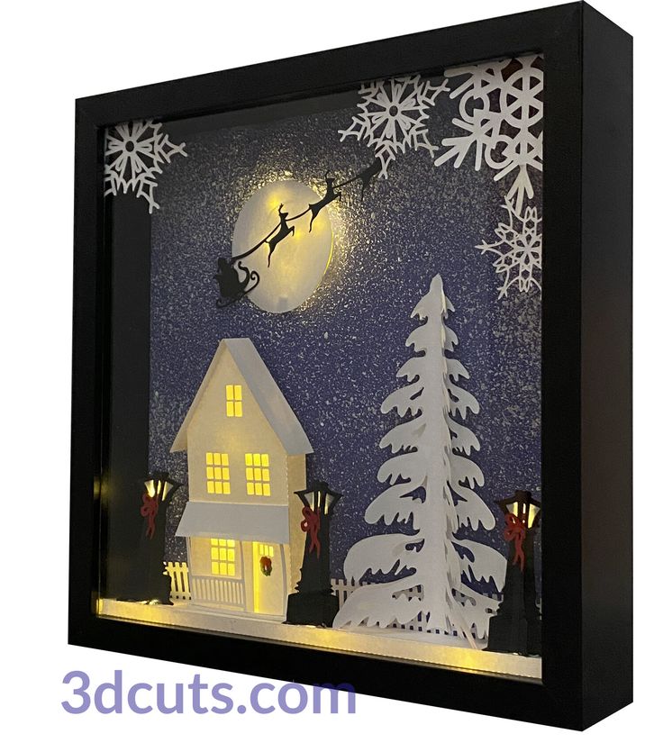 a paper cut christmas scene with santa flying over the house and snowflakes on the roof