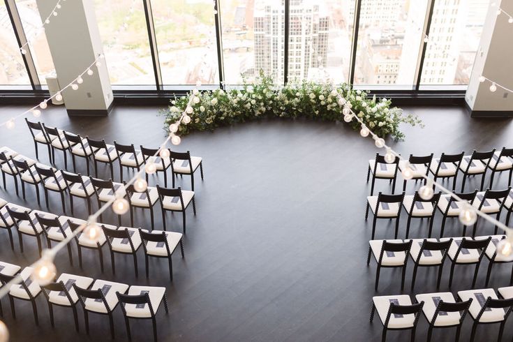 an overhead view of a wedding ceremony setup with candles and greenery on the floor