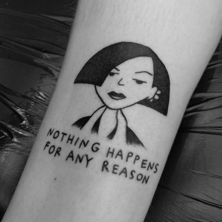 a woman's arm with a tattoo saying nothing happens for any reason