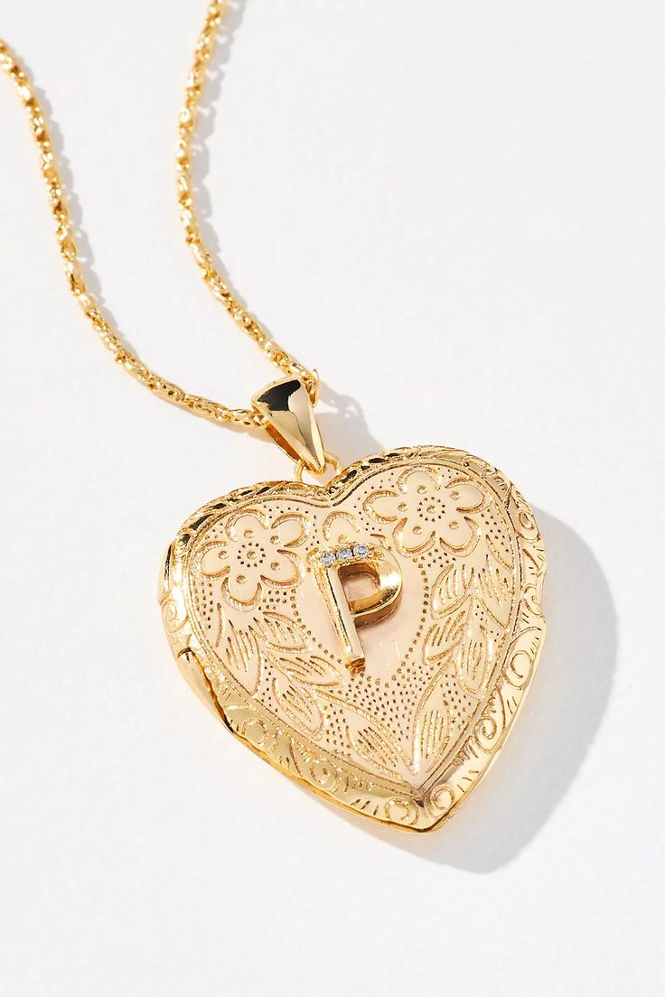 Monogram Heart Locket Necklace | Anthropologie Elegant Medallion Locket Necklace For Mother's Day, Elegant Charms Locket Necklace For Mother's Day, Gold Initial Pendant Locket Necklace With Charms, Gold-tone Jewelry For Valentine's Anniversary, Gold Locket Necklace With Initial Pendant And Charms, Gold-tone Jewelry For Anniversary On Valentine's Day, Gold Heart Charm Locket Necklace, Vintage Gold Jewelry For Personalized Gift, Gold-tone Locket Necklace