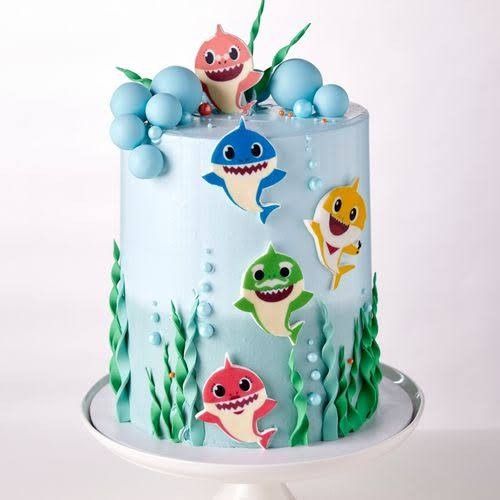 there is a cake decorated with different types of sharks