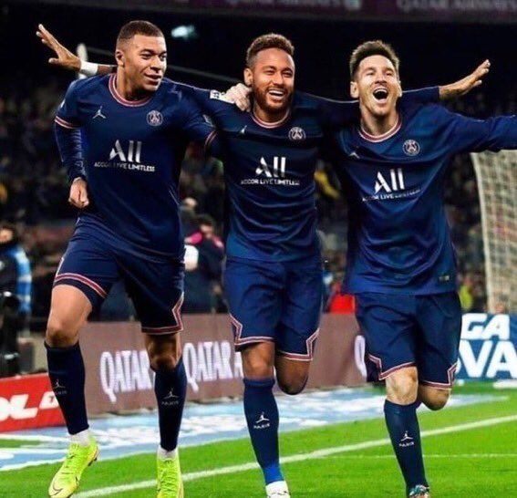 three soccer players are celebrating on the field