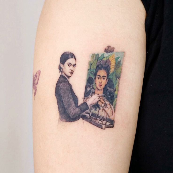 a woman's arm with a painting on it and a man holding an object