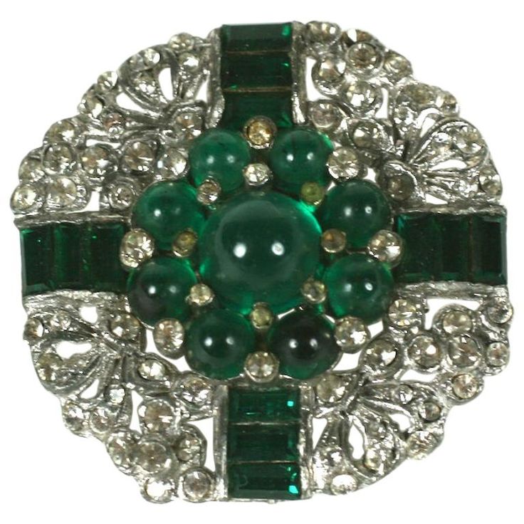 Art Deco Emerald Cab Brooch from the 1930's. High quality manufacture with channel set emerald paste baguettes and cabochons. Likely unsigned Trifari. 1.4" across. USA 1930's. 1930 Jewelry, Emerald Brooch, Art Deco Emerald, Channel Set, High Jewelry, Ornament Wreath, Costume Jewelry, Brooch Pin, Emerald