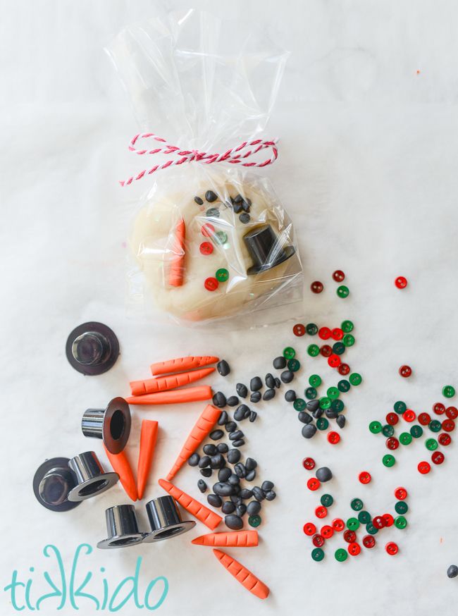 carrots, candy and other candies are on the table next to a bag