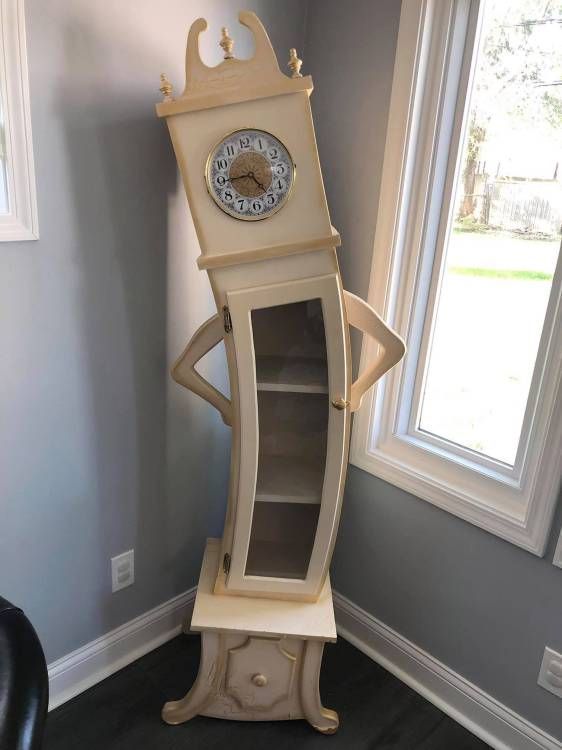 an old grandfather clock in the corner of a room