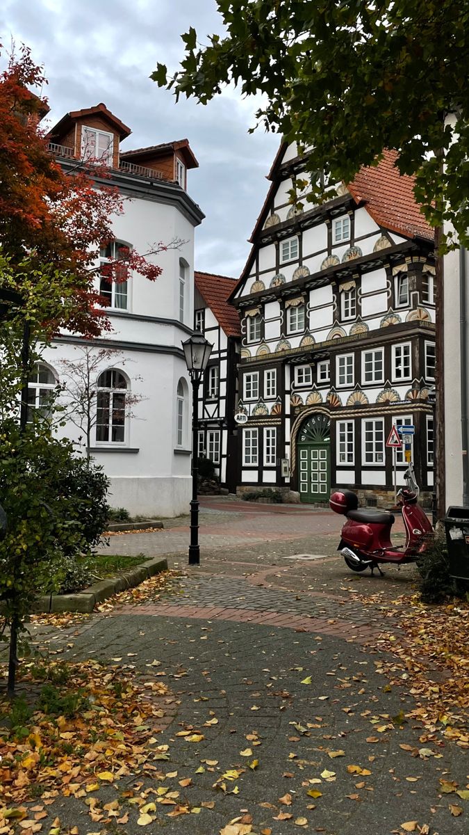 a scooter is parked in front of an old building