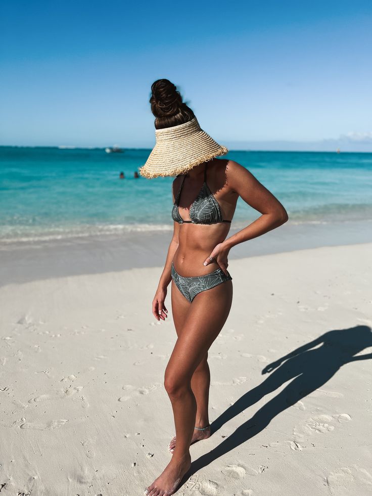 A fan favorite triangle bikini top. You can never have too many triangle tops. You will get the perfect tan all the way around. Featured in our Caicos Palm fabric with the Olive fabric on the reverse side. They pair well with the Caicos Palm & Olive OASIS Bottoms. Available in sizes XS-XL. All of our tops and bottoms are reversible which means you get 2-4 suits out of each pair. Details This style runs true to size. Bella is 5'5" wearing a size small. Caicos Palm: 82% Polyester & 18% Spandex Oli Triangle Swimwear For Beach Season And Pool, Triangle Beachwear Swimwear For Vacation, Triangle Beachwear Swimwear For Poolside, Triangle Swimwear For Sunbathing In Summer, Triangle Swimwear For Beach Season, Triangle Beachwear For Poolside, Triangle Swimwear For Poolside And Beach Season, Beachy Triangle Swimwear For Beach Season, Beachy Triangle Swimwear For Vacation