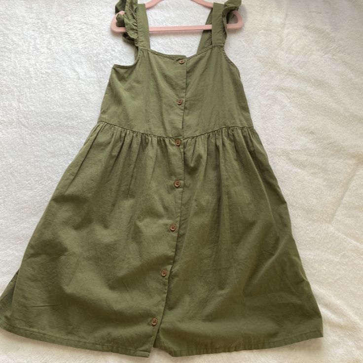 A Light Summer Sundress For Girls. 100% Cotton. Size 7-8 Years. Green (Khaki) Color. On Straps. There Are Buttons Along The Entire Length Of The Dress That Make It Easier To Put On The Dress. No Tag, But Never Worn. Green Casual Dress For Playdate, Casual Green Dresses For Playdate, Casual H&m Dresses With Ruffles, Casual Cotton Sundress For Playdate, H&m Cotton Sundress, Unicorn Dress Girls, Girls Ruffle Dress, Child Clothes, Sage Green Dress