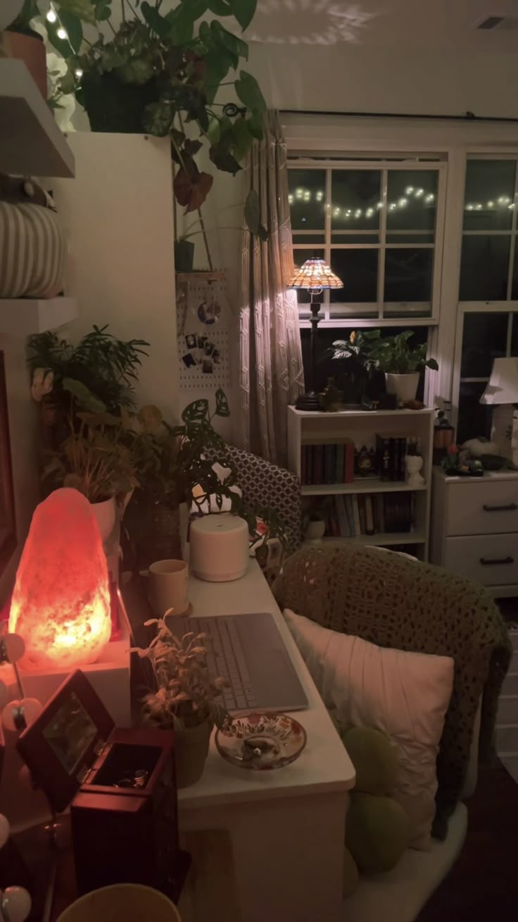 a living room filled with furniture and a fire place in the middle of the room