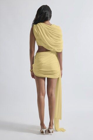 Yellow malai lycra and net asymmetric draped short dress with cut-out detailing. - Aza Fashions Cocktail Draped Ruched Skirt, Cocktail Pre-draped Ruched Skirt, Asymmetrical Ruched Dresses For Party, Asymmetrical Ruched Dress For Parties, Draped Mini Dress For Party, Pre-draped Ruched Cocktail Skirt, Fitted Draped Skirt With Asymmetrical Hem For Cocktail, Summer Asymmetrical Dress With Draped Sleeves, Draped Bodycon Dress For Night Out