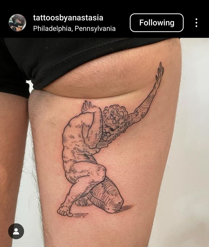 a woman's thigh with a tattoo on it that has an image of a man kneeling down